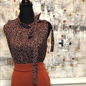 Tiffany & Grey orange,black & white multicolored sleeveless blouse with side bow